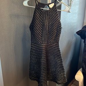 Sienna Sky Dress used once.. Size X-small black/gold